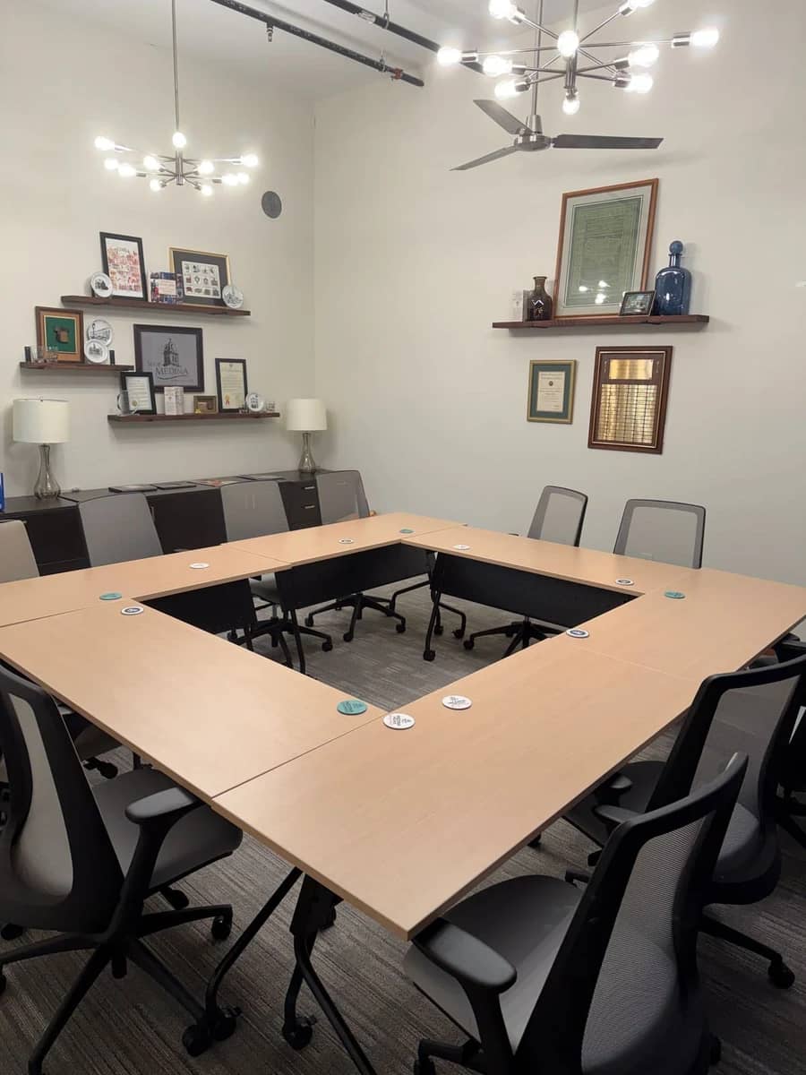 The Vault set for a meeting around a square conference table